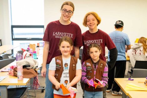 Lafayette students smiling and posing with Girl Scouts