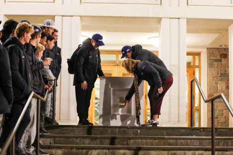 President Nicole Hurd presses a button to light the quad.