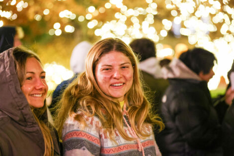 Students enjoy the lighting of the Quad.
