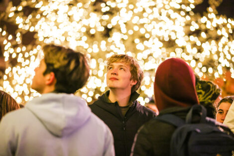 Students enjoy the lighting of the Quad.