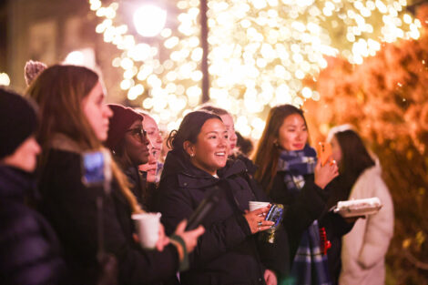 Students enjoy the lighting of the Quad.