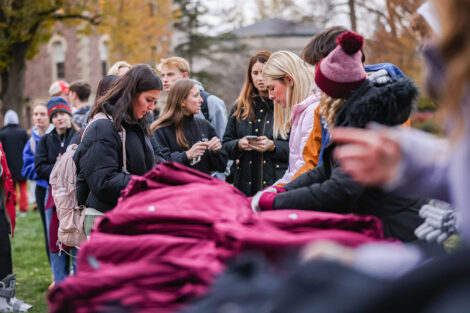Students look at rivalry t-shirts.