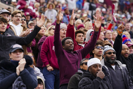 Alums in the crowd cheer for a touchdown.