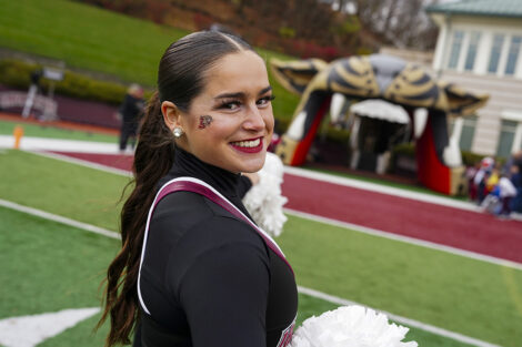 A cheerleader smiles