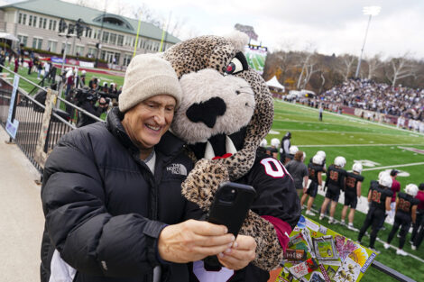 The Leopard takes a selfie with an alum.