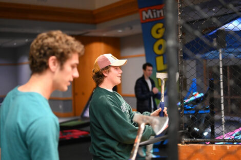 Students throw axes.