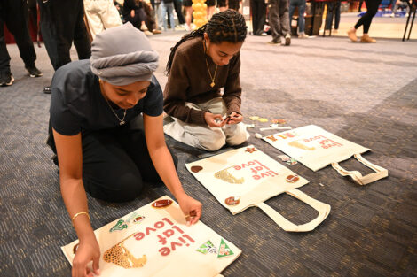Students create canvas totes that read 