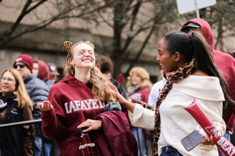 Two students decked out in Lafayette and Leopard gear smile
