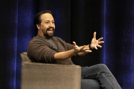 Lin-Manuel Miranda talks animatedly on stage at Lafayette College
