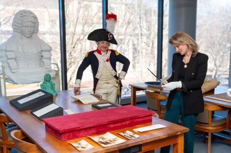 Consul General of France Caroline Monvoisin handles the Marquis's sword
