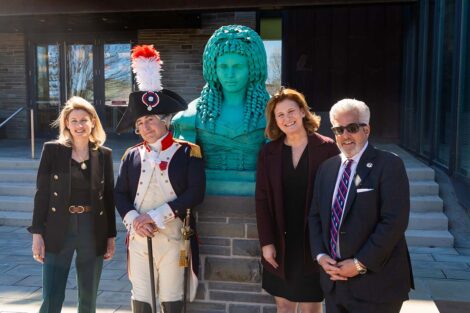 The President stands in front of the Adrienne statue with the Marquis and Consul General