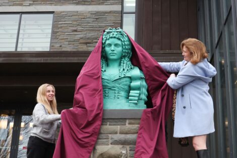 Allie Waxman ’28, president of student government, joins President Nicole Hurd in unveiling Adrienne at Skillman Library on March 7. Photo by Ashli Truchon Novak