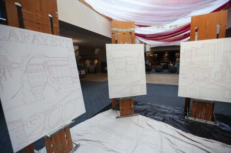 Easels in Farinon holding the unpainted Founders' Week mural panels