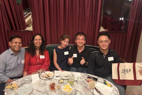 People sit at a table and smile