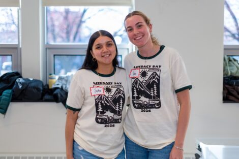 Two Lafayette volunteers in Literacy Day shirts pose for a picture.