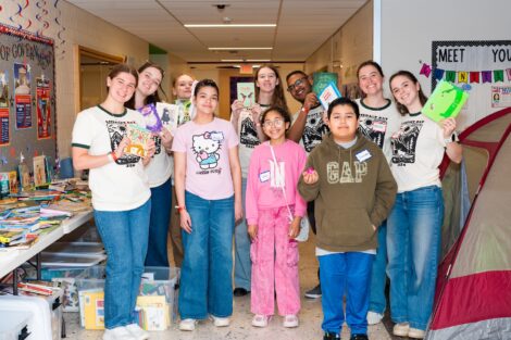 Lafayette students stand with EASD students holding up books at Literacy Day.