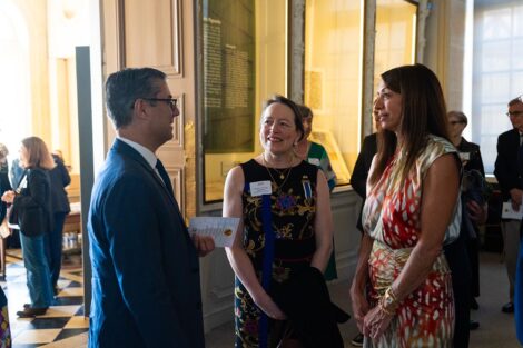 Lafayette alumni Benny Crapanzano '97 and Fran Della Badia ’91 chatted with Virginie de Pusy Lafayette (center) during the exhibition reception.