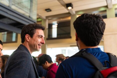 After the alumni panel, Valentin '02 (left) and an engineering student continue the dialogue.
