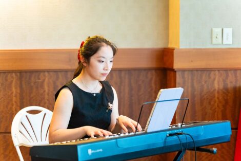A person plays keyboard at Pan-Asian Celebration.