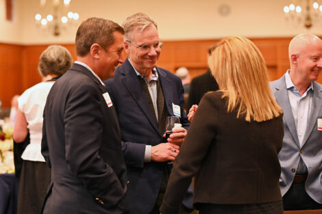 Faculty and staff members talk at the Faculty/Staff Awards.
