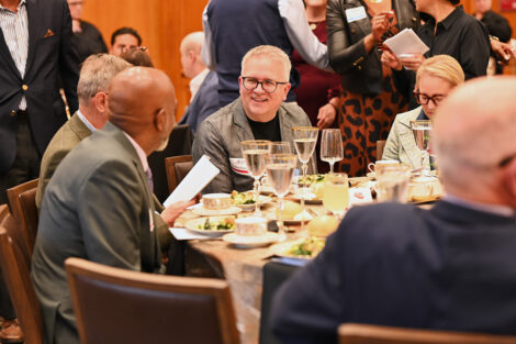 Faculty and staff members talk at the Faculty/Staff Awards.