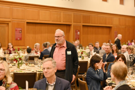 An award recipient stands.