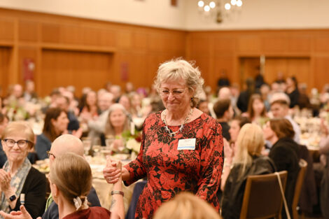 An award recipient stands.
