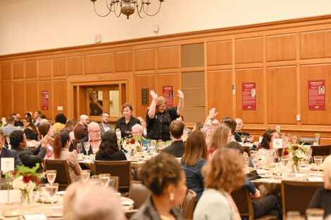 A faculty member stands up during the Faculty/Staff Awards.