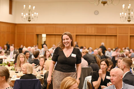 A staff member stands up during the Faculty/Staff Awards.