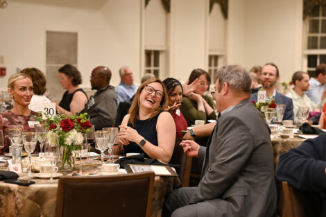 Faculty celebrate with each other.