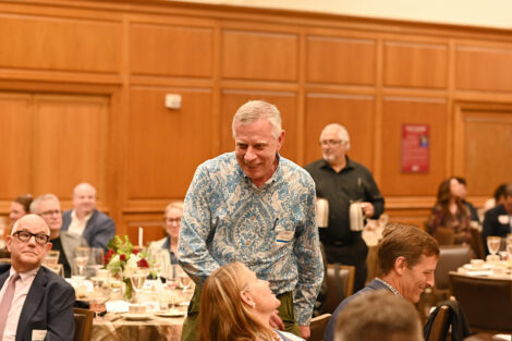 A faculty member stands up during the Faculty/Staff Awards.