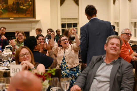 Faculty cheer.