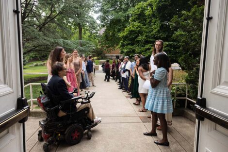 A group greets attendees for Baccalaureate