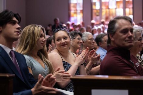 The audience smiles at Baccalaureate