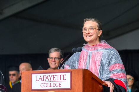 Alex Hendrickson smiles at the podium.