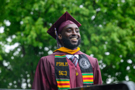 A graduate smiles