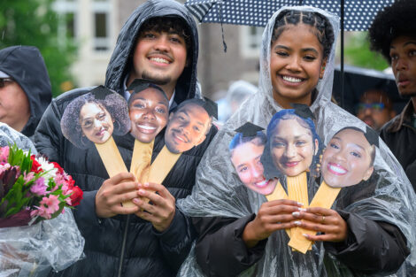 Families share little signs for their loved ones who are graduating.