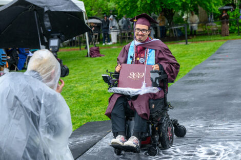 Dexter Kennedy poses with his diploma
