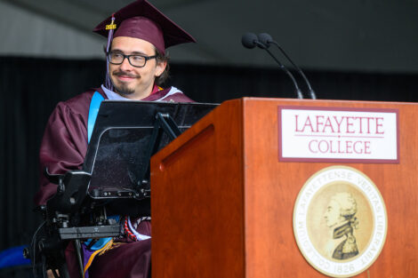 Dexter Kennedy speaks at the podium during Commencement.