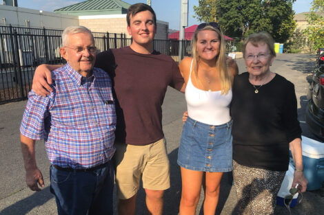 Gordon and Ruth Macdonald P’89, GP ’19,’22 are pictured with their grandchildren, Alexander '22 and Haley '19 at Homecoming. They are standing outside on Lafayette's campus.