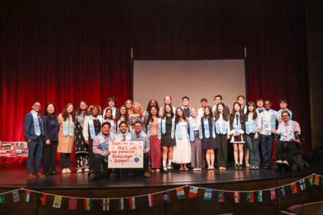 A group photo at International Celebration. The sign reads