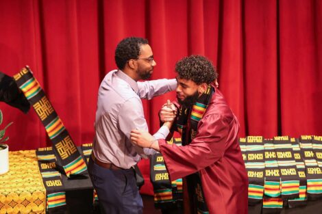 A student receives a stole at the Donning of the Kente