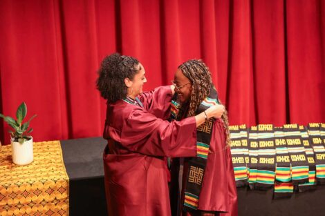 A student receives a stole at the Donning of the Kente