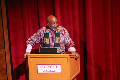 A speaker at the Donning of the Kente