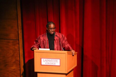 A speaker at the Donning of the Kente