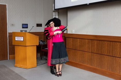 Rachel Goshgarian hugs a cord recipient at Posse Celebration