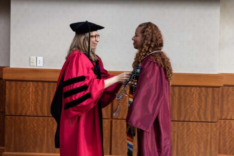 A student receives cords at Posse Celebration