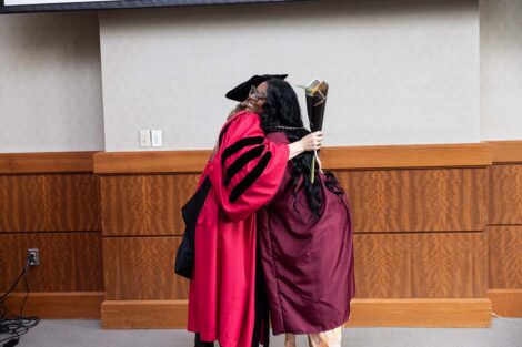 A student hugs at Posse Celebration