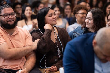 A student receives a cord at Posse Celebration