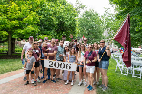 Members of the Class of 2006 are standing and holding a sign.